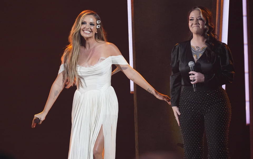 Carly Pearce, left, and Ashley McBryde perform at the 55th annual CMA Awards on Wednesday, Nov. 10, 2021, at the Bridgestone Arena in Nashville, Tenn. (AP Photo/Mark Humphrey)