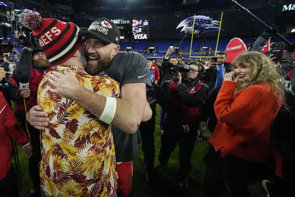 Travis Kelce embraces his NFL player brother, Jason Kelce, who plays for the Philadelphia Eagles.