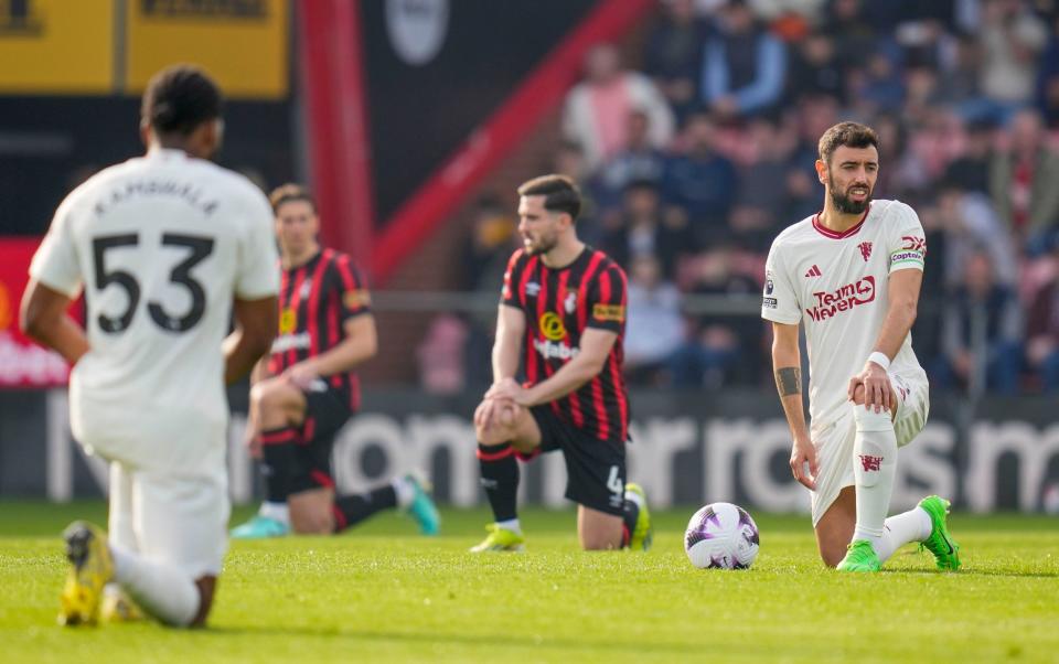 Bournemouth and Man Utd players take a knee ahead of kick off.