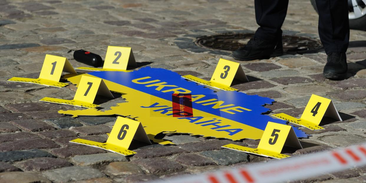 Ukraine map on ground with numbers placed on it as if it were a crime scene