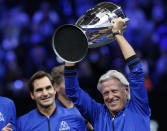 FILE - Team Europe's Bjorn Borg, right, and Roger Federer celebrate with the Laver Cup after defeating Team World on Sept. 23, 2018, in Chicago. (AP Photo/Jim Young, File)