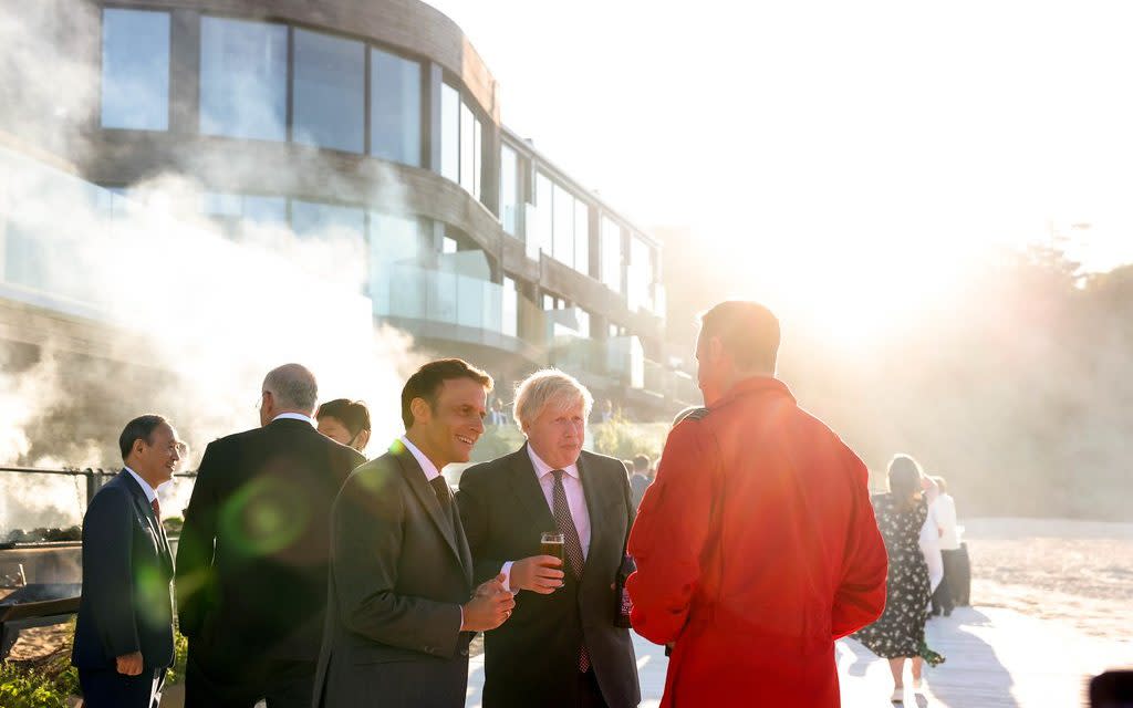 Boris Johnson with Emmanuel Macron talking to a Red Arrows pilot at the G7 Summit in Carbis Bay - Andrew Parsons / No10 Downing St 