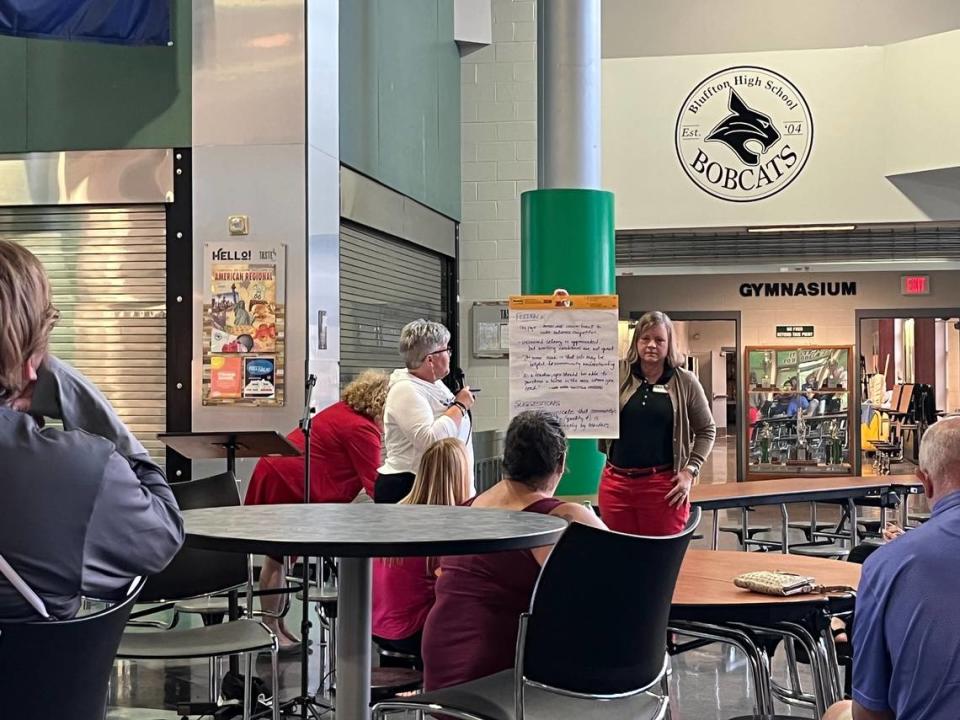 A school district employee outlined needs and suggestions at a May 11 meeting at Bluffton High School regarding salary raises for teachers.