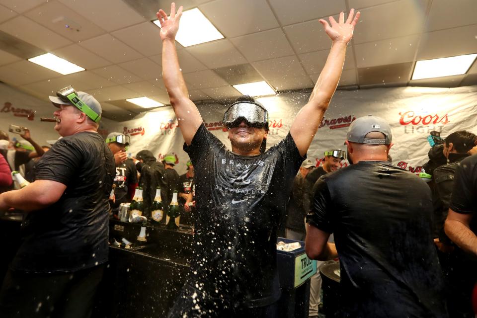 MIAMI, FLORIDA - OCTOBER 04: An Atlanta Braves player celebrates after the Atlanta Braves clinched the division against the Miami Marlins at loanDepot park on October 04, 2022 in Miami, Florida. (Photo by Megan Briggs/Getty Images)