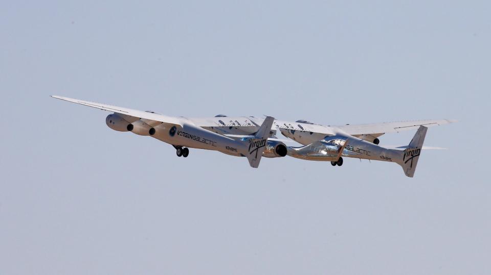 Virgin Galactic's passenger rocket plane VSS Unity takes off with carrier jet