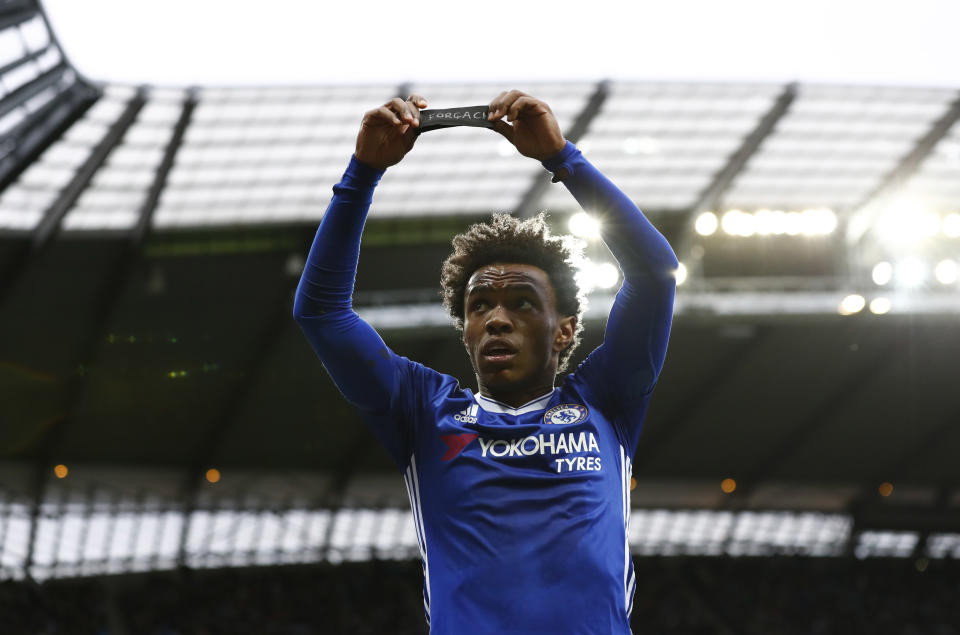 Britain Football Soccer - Manchester City v Chelsea - Premier League - Etihad Stadium - 3/12/16 Chelsea's Willian celebrates scoring their second goal holds a armband in respect for the victims of the Colombia plane crash containing the Chapecoense players and staff Action Images via Reuters / Jason Cairnduff Livepic EDITORIAL USE ONLY. No use with unauthorized audio, video, data, fixture lists, club/league logos or "live" services. Online in-match use limited to 45 images, no video emulation. No use in betting, games or single club/league/player publications. Please contact your account representative for further details.