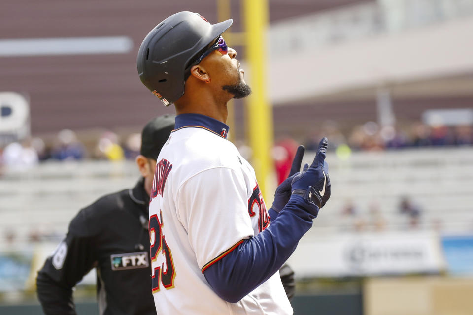 Minnesota Twins' Byron Buxton (25) kisses his hand and points to the sky after hitting a solo home run during the first inning of a baseball game, Sunday, April 10, 2022, in Minneapolis. (AP Photo/Nicole Neri)