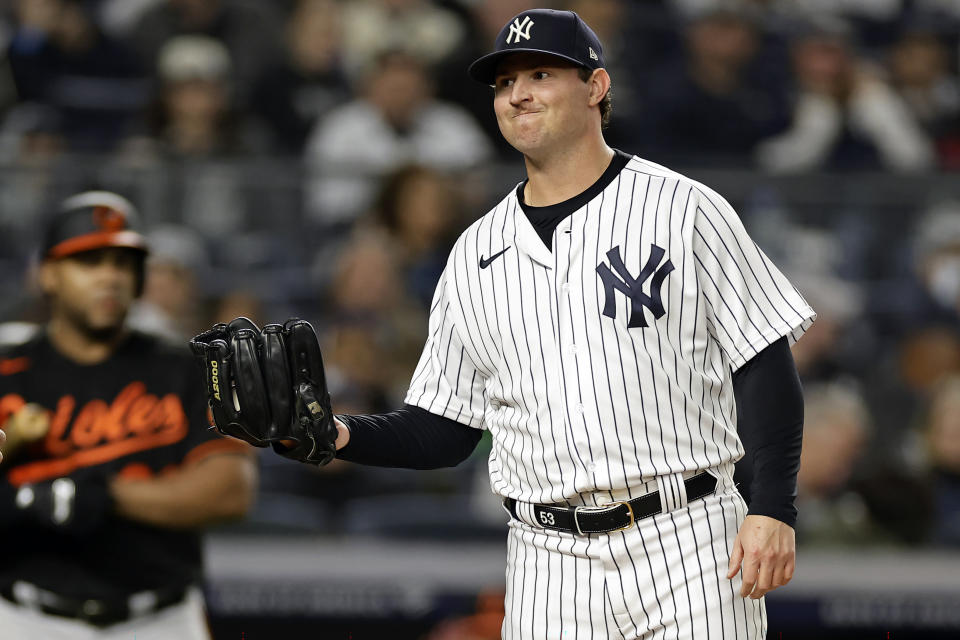 New York Yankees pitcher Zack Britton reacts after throwing a wild pitch during the sixth inning of the team's baseball game against the Baltimore Orioles on Friday, Sept. 30, 2022, in New York. (AP Photo/Adam Hunger)