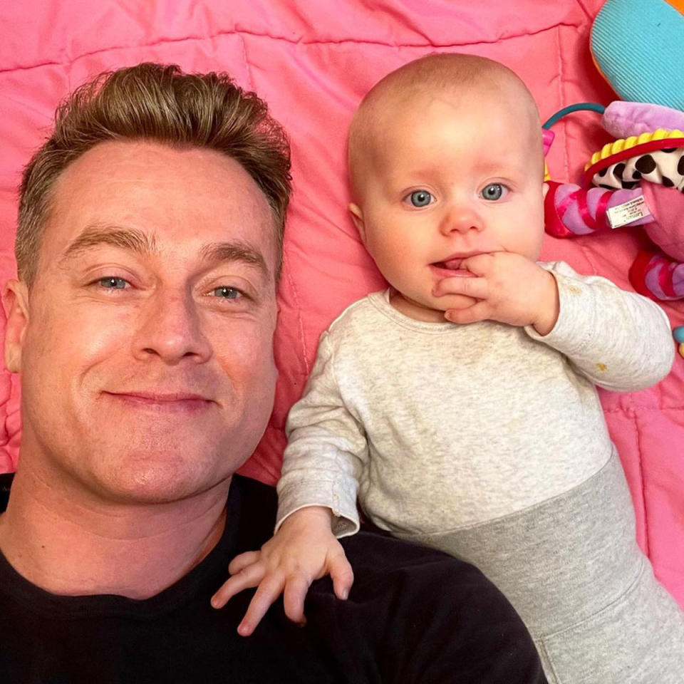 Grant Denyer and his baby Sunday take a selfie together. 
