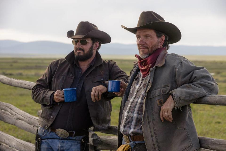 Cole Hauser as Rip Wheeler (left) chats with a cowboy friend on “Yellowstone,” Season 5, episode 4.
