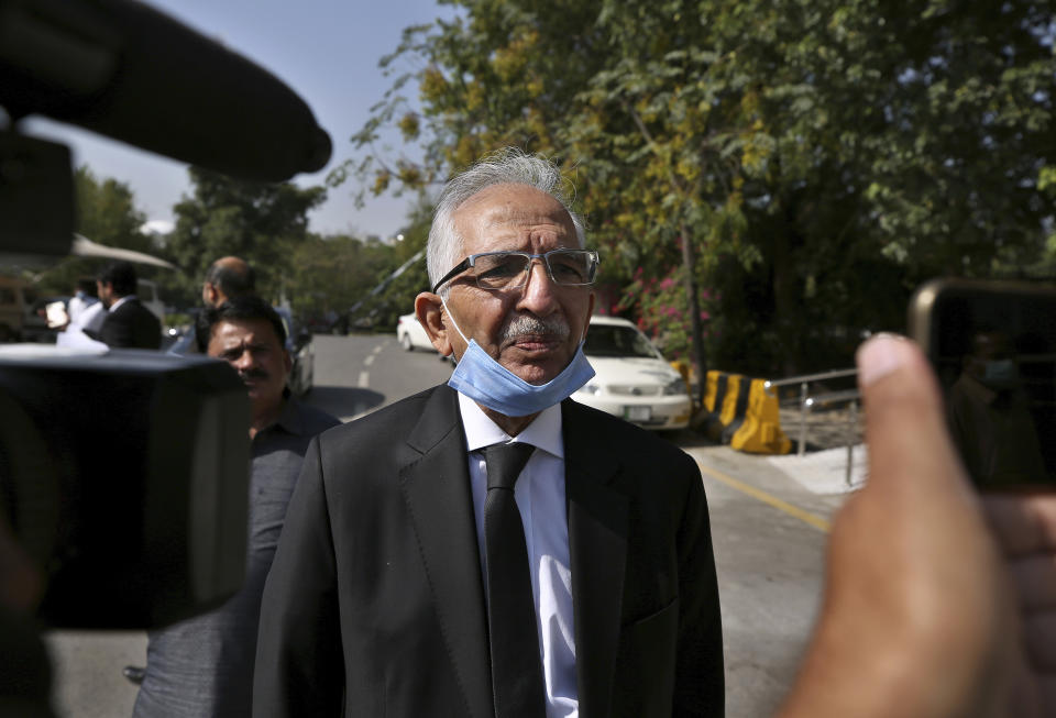 Mahmood Ahmed Sheikh, defense lawyer of British-born Pakistani Ahmed Omar Saeed Sheikh, talks to media outside the Supreme Court after an appeal hearing in the Daniel Pearl's case, in Islamabad, Pakistan, Wednesday, Oct. 7, 2020. Sheikh, who has been on death row over the 2002 killing of U.S. journalist Pearl, will remain in jail for another three months under a government order, a prosecutor told the country's top court Wednesday. (AP Photo/Anjum Naveed)