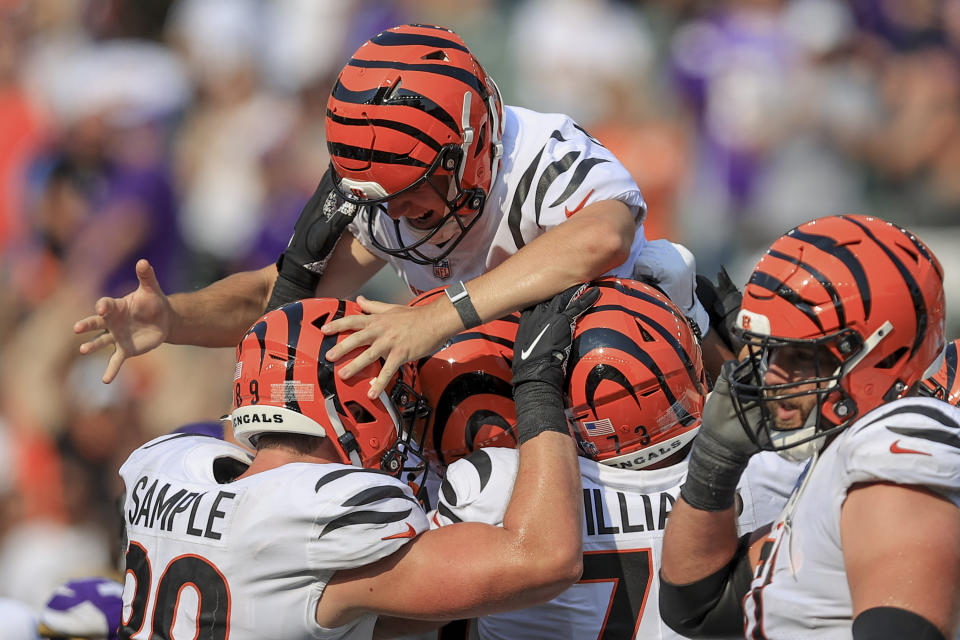 Cincinnati Bengals kicker Evan McPherson (2) is lifted by teammates after hitting a field goal to defeat the Minnesota Vikings during overtime of an NFL football game, Sunday, Sept. 12, 2021, in Cincinnati. The Bengals won 27-24. (AP Photo/Aaron Doster)