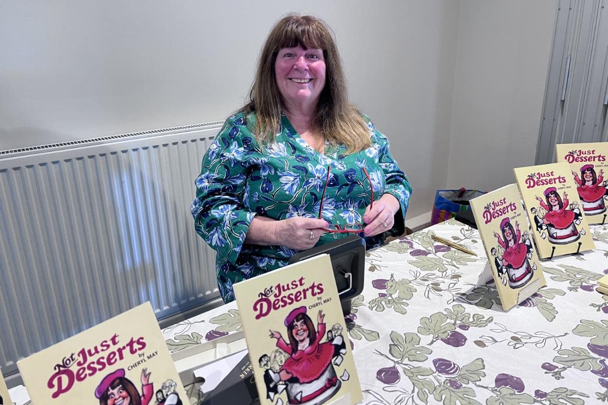 Cheryl May with her publication <i>(Image: Roz Whistance)</i>