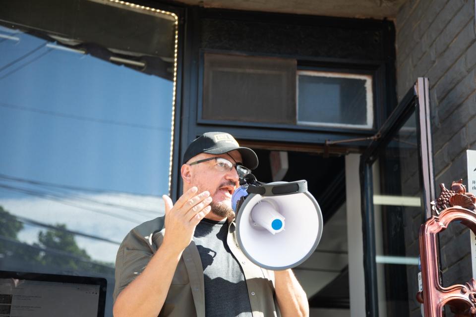 Oath Keeper President Stewart Rhodes speaks to the crowd outside Casa di Dolore tattoo shop in Newburgh on Saturday, May 30, 2020.