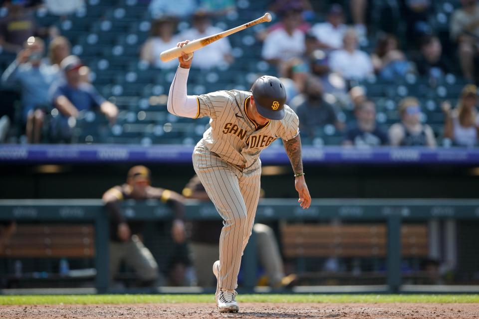 Manny Machado reacts after flying out against the Rockies.