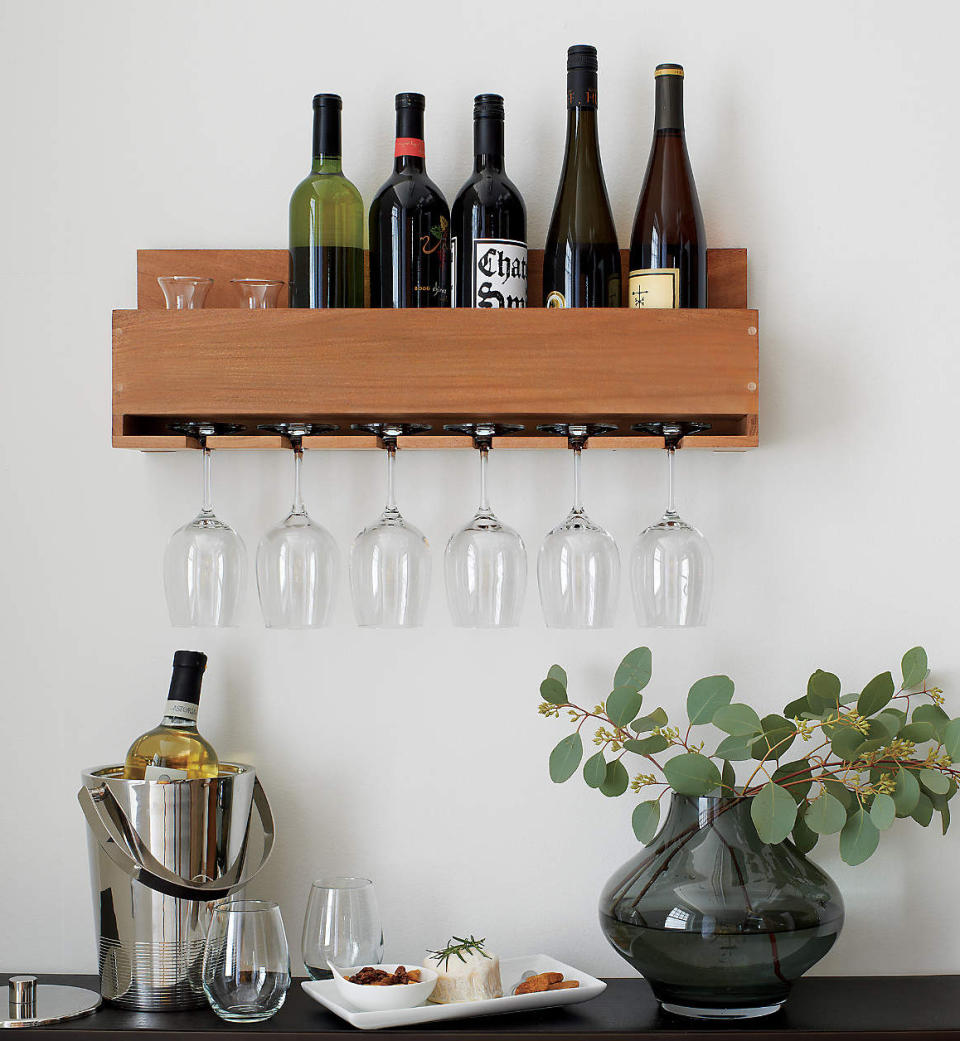 <p>We like our wine where we can see it. Yes, wine racks are great space savers, but they take all the fun out of gazing longingly at the labels each time you walk past. Enter this sleek and sturdy acacia wood shelf, which holds half a case of wine, six stem glasses and the key to our hearts. </p> <p><strong>Buy It!</strong> Crate and Barrel Wine-Stem Rack, $50; <a href="https://www.anrdoezrs.net/links/8029122/type/dlg/sid/PEOInVinoVeritasTheBestGiftsfortheWineLoversinYourLifesdodd1271FooGal12969305202111I/https://www.crateandbarrel.com/wine-stem-rack/s681734?localedetail=US&storeid=633&a=1552&campaignid=9986587406&adgroupid=100019505999&targetid=pla-471718177139&pla_sku=681734&pcat=HSW&ag=adult&gclid=CjwKCAiA4veMBhAMEiwAU4XRryjnLGCmMxm8dZhyjpJ6Jvg4sNzvKB5cqmOisspddtF2TrbubulCUxoCjZcQAvD_BwE" rel="sponsored noopener" target="_blank" data-ylk="slk:crateandbarrel.com;elm:context_link;itc:0;sec:content-canvas" class="link ">crateandbarrel.com</a></p>