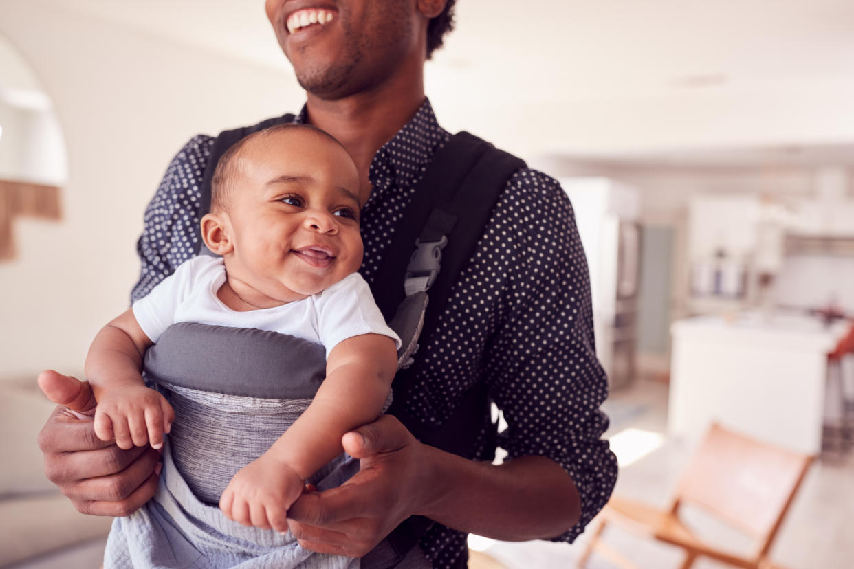 Using a baby carrier or sling can help foster bonding, experts say — but they aren't for everyone. (Photo: Getty Creative)