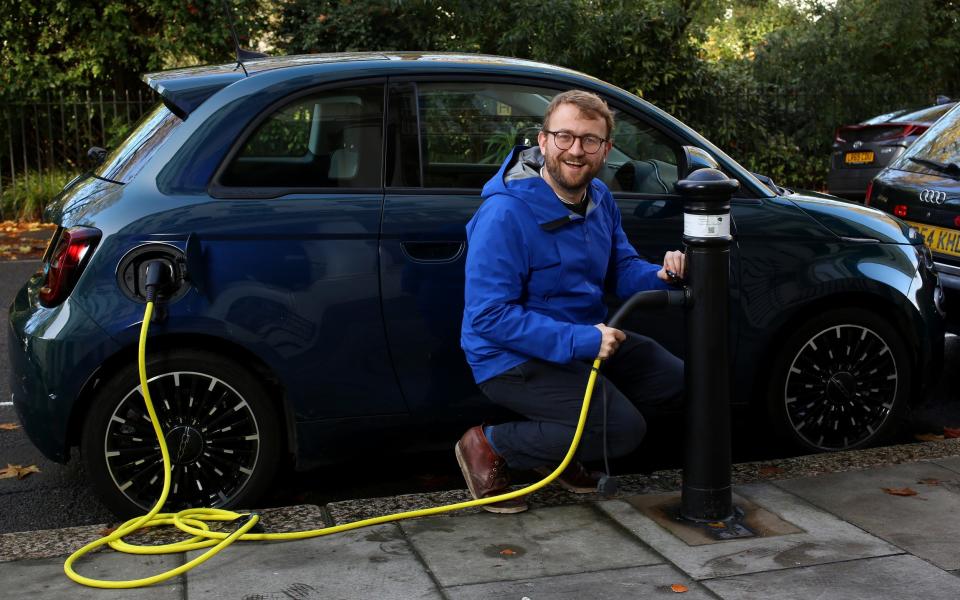 Writer Ed Cumming testing out a Fiat 500e electric car as he weighs up whether to buy an electric car for his family - Clara Molden for The Telegraph