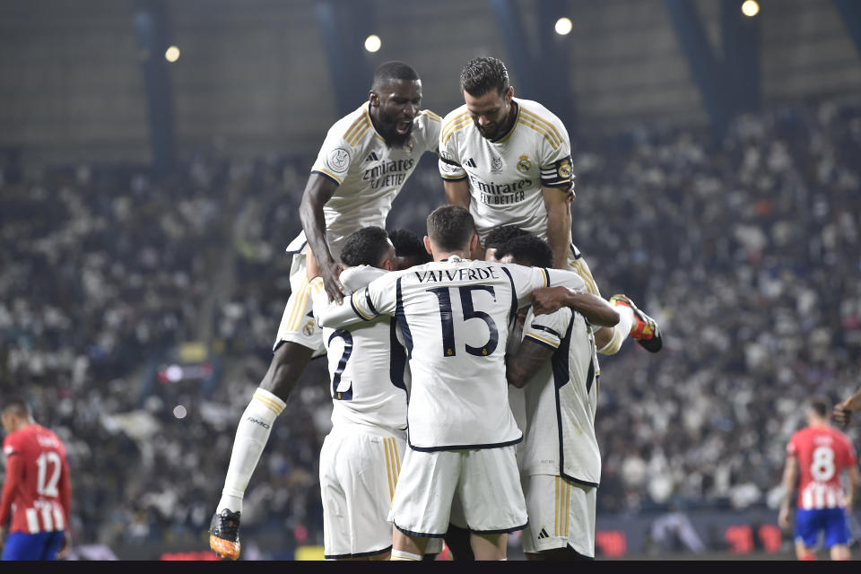 Real Madrid players celebrate scoring their first goal during the Semi Final of Spanish Super Cup match between Real Madrid and Atletico Madrid at Al Awal Park Stadium in Riyadh, Saudi Arabia, Wednesday, Jan. 10, 2024. (AP Photo)