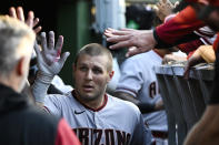 Arizona Diamondbacks' Daulton Varsho is congratulated in the dugout after his home run against the Chicago Cubs during the fourth inning of a baseball game in Chicago, Thursday, May 19, 2022. (AP Photo/Matt Marton)