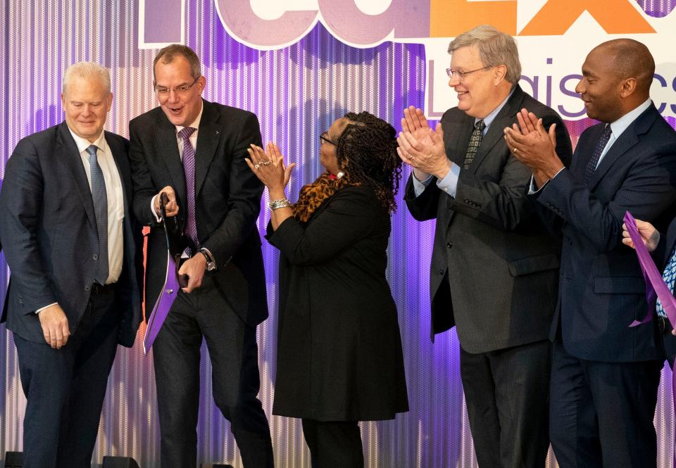 President and CEO of FedEx Logistics Udo Lange cuts a ribbon with other FedEx and Memphis executives during the grand opening for the new FedEx Logistics headquarters Tuesday, April 5, 2022, in Memphis. 