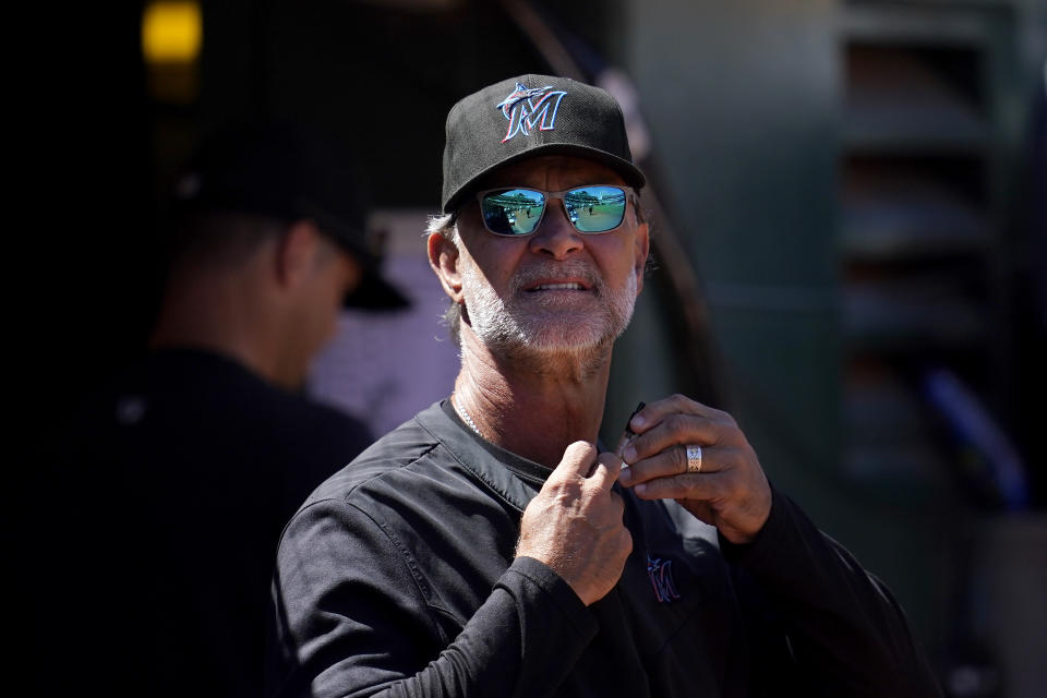 Miami Marlins manager Don Mattingly watches from the dugout during the eighth inning of a baseball game against the Oakland Athletics in Oakland, Calif., Wednesday, Aug. 24, 2022. (AP Photo/Jeff Chiu)