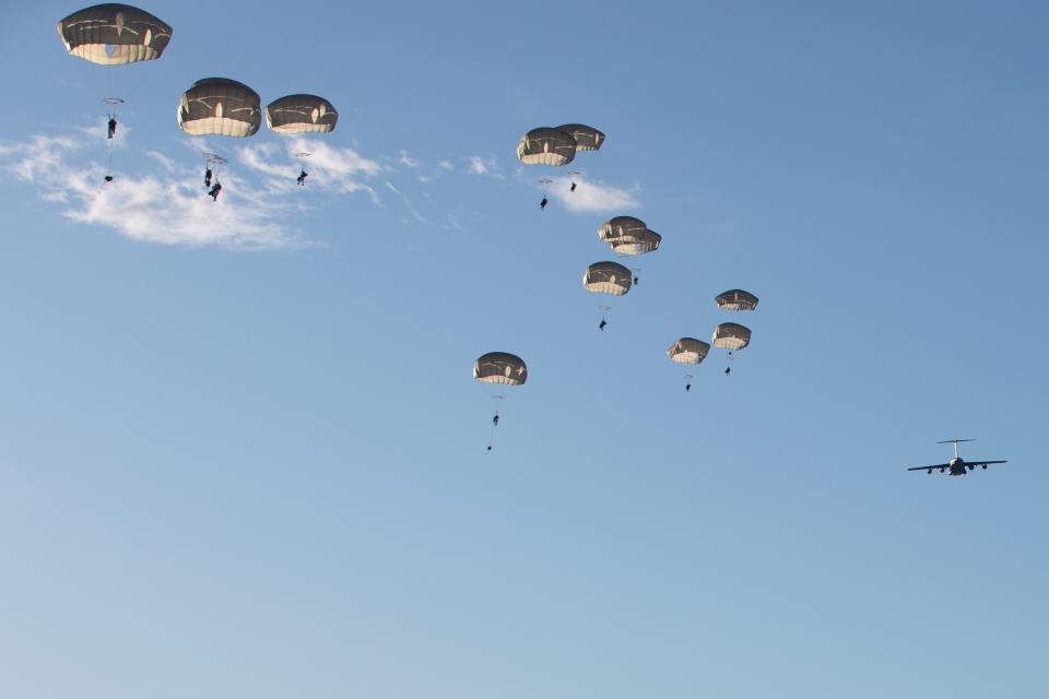 U.S. Army Soldiers from 3rd Battalion, 509th Parachute Infantry Regiment, 2nd Infantry Brigade Combat Team (Airborne), 11th Airborne Division, descent onto Donnelly Drop Zone as part of Joint Pacific Multinational Readiness Center 24-02 at Donnelly Training Area, Alaska, Feb 8, 2024.
