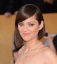 <p>If you love bob haircuts but don't like how flat they can make your hair look, try an asymmetrical bob like actress <strong>Marion Cotillard</strong> that's angled downwards from the back, drawing viewers' eyes downward rather than to your hair's volume. Part it to one side to give the illusion of added volume.</p>