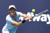 Jannik Sinner, of Italy, returns to Roberto Bautista Agut, of Spain, during the semifinals of the Miami Open tennis tournament, Friday, April 2, 2021, in Miami Gardens, Fla. (AP Photo/Lynne Sladky)