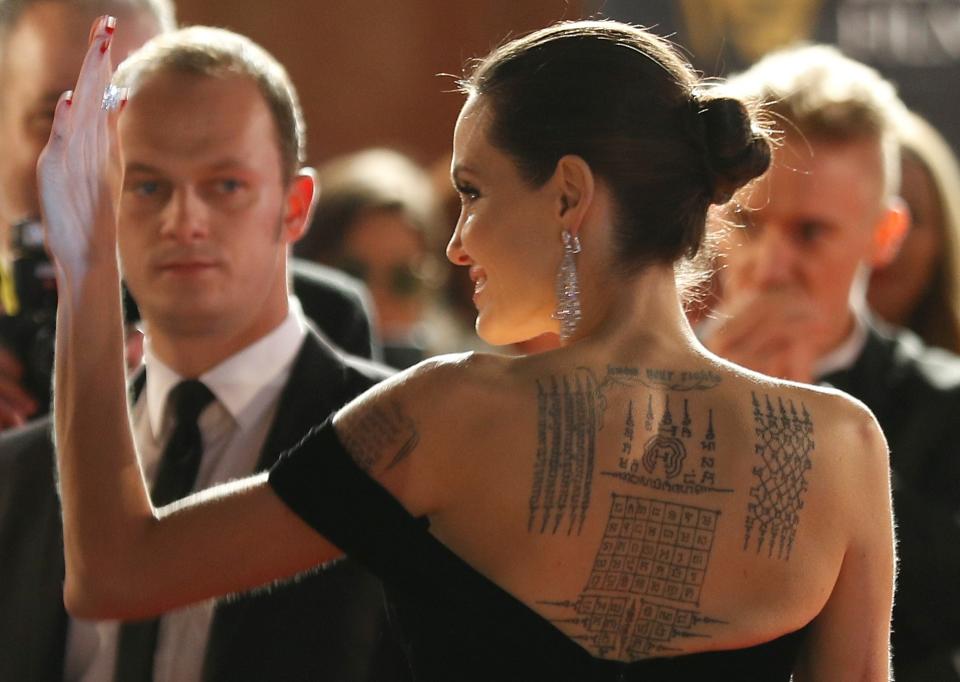 The stories they tell - Angelina Jolie shows off her tattoos. 