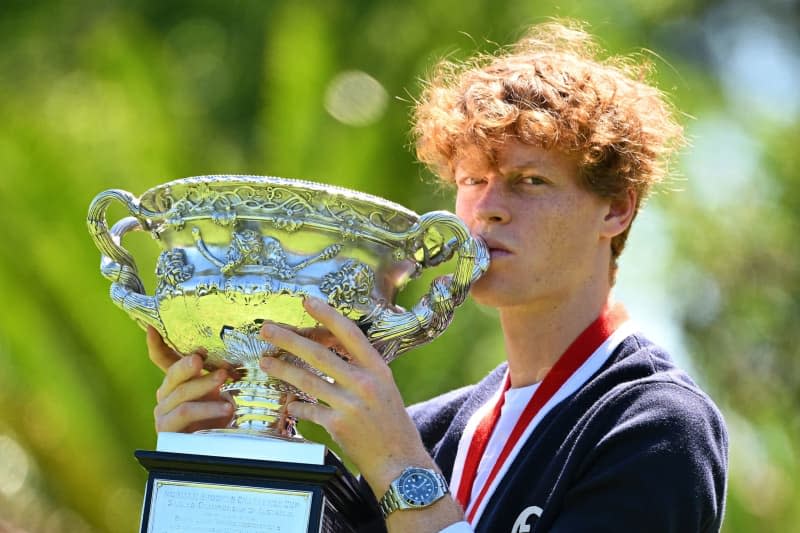 Italian tennis player Jannik Sinner poses with the Norman Brookes Challenge Cup following his victory over Russia's Daniil Medvedev in the Men’s Singles final tennis match of the 2024 Australian Open. James Ross/AAP/dpa