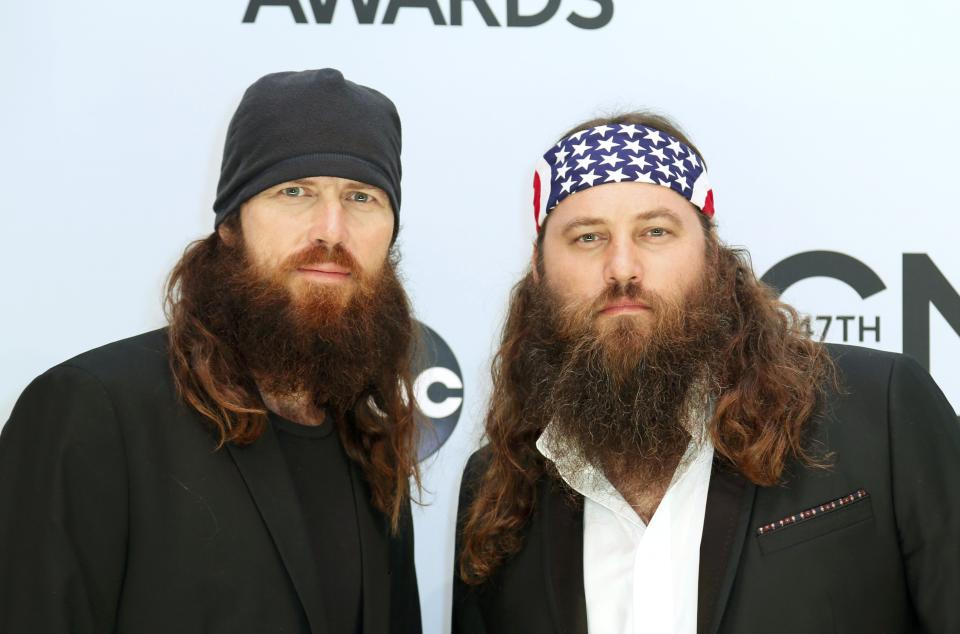 Jase Robertson and Willie Robertson from the Duck Dynasty TV show pose on arrival at the 47th Country Music Association Awards in Nashville