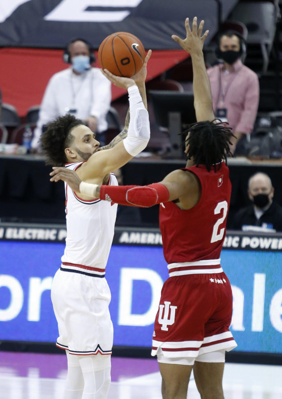 Ohio State guard Duane Washington, left, goes up for a shot against Indiana guard Armaan Franklin during the first half of an NCAA college basketball game in Columbus, Ohio, Saturday, Feb. 13, 2021. (AP Photo/Paul Vernon)