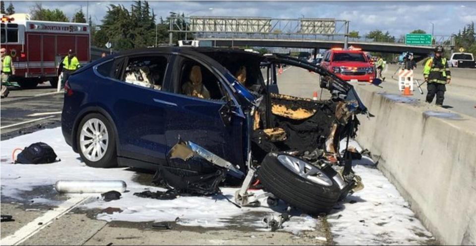 A destroyed Tesla vehicle after a crash.