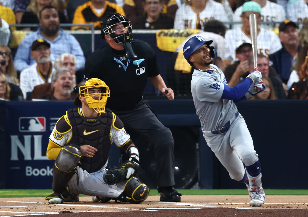 SAN DIEGO, CALIFORNIA - OCTOBER 08: Mookie Betts #50 of the Los Angeles Dodgers hits a home run in the first inning against the San Diego Padres during Game Three of the Division Series at Petco Park on October 08, 2024 in San Diego, California. (Photo by Katelyn Mulcahy/Getty Images)