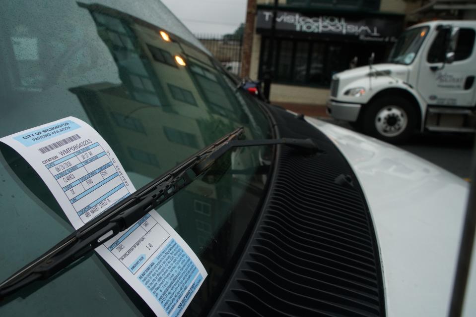 A vehicle along Market Street in Wilmington is ticketed.