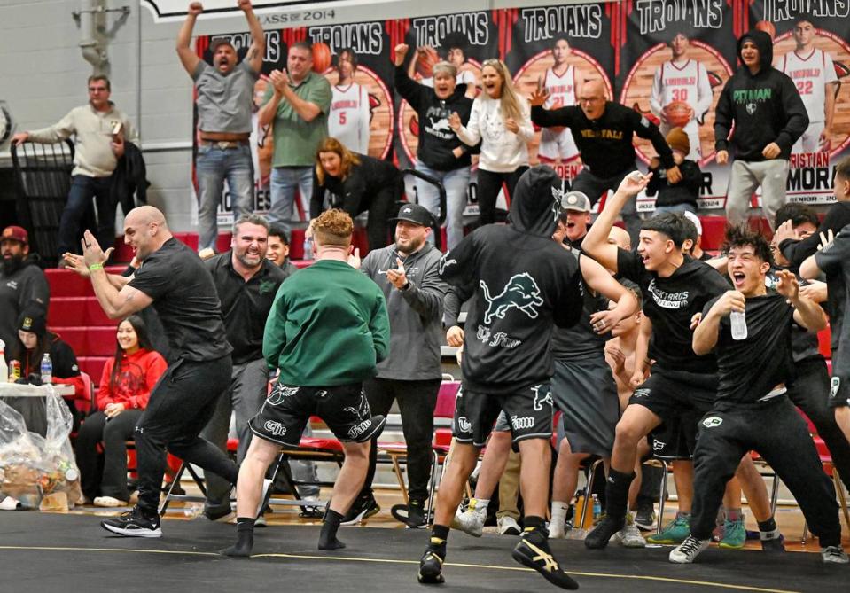 The Pitman bench erupts in celebration after their victory in the final match to give them a 37-34 win over Ponderosa in the Sac-Joaquin Section DII team championship at Lincoln High School in Stockton, Calif., Saturday, Jan. 27, 2024.