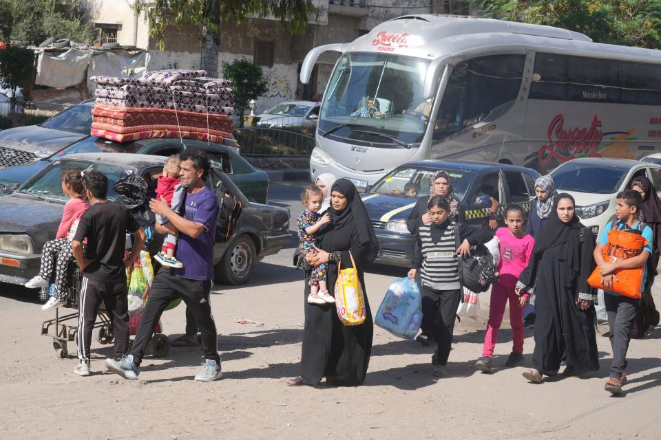Palestinians flee to the southern Gaza Strip after the Israeli army issued an evacuation warning to a population of over 1 million in northern Gaza and Gaza City ahead of a planned Israeli ground invasion, Friday, Oct. 13, 2023. (AP Photo/Hatem Moussa) ORG XMIT: DV241