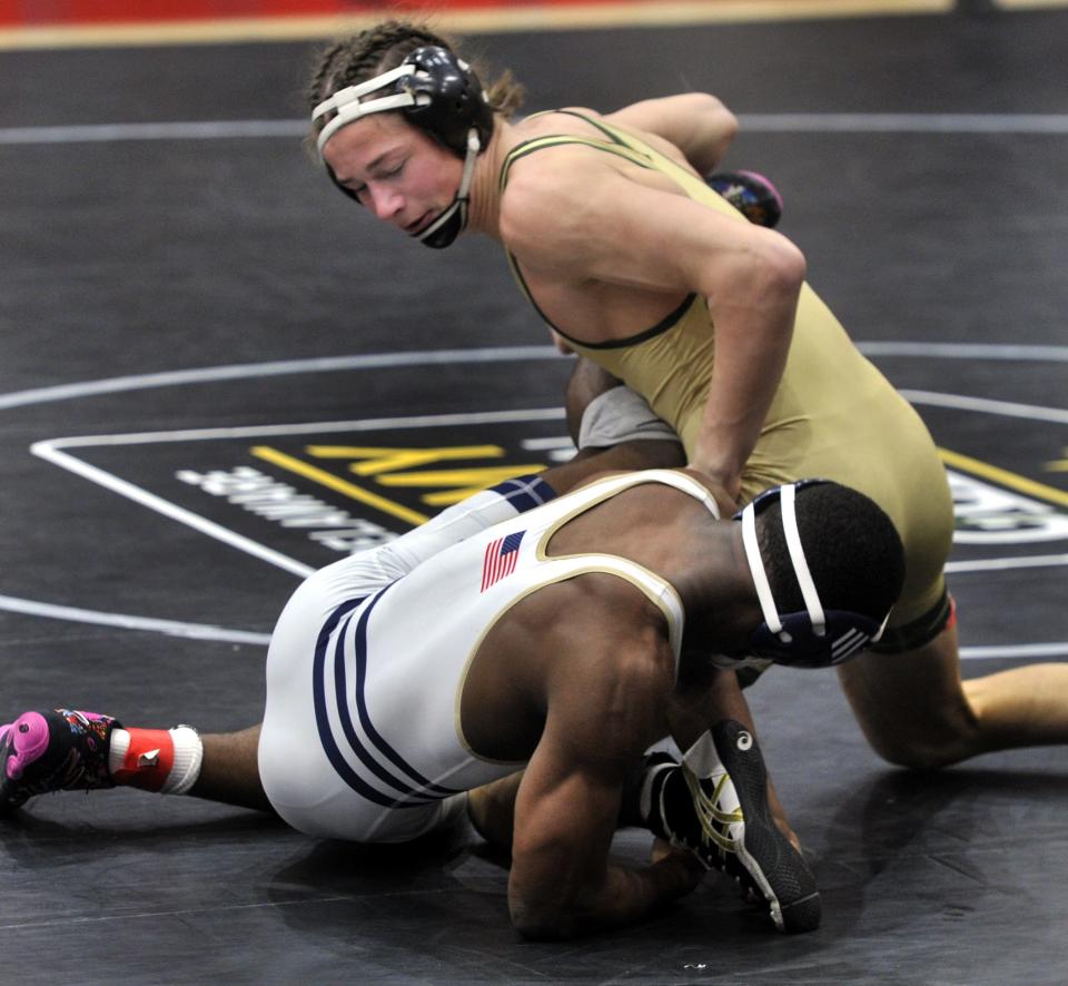 Malcolm Roy of Delaware Military won his 157-pound match by pinning Brayden Ranauto of Saint Mark's.