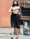 <p>Famke Janssen has her hands full while out in N.Y.C. on Tuesday.</p>