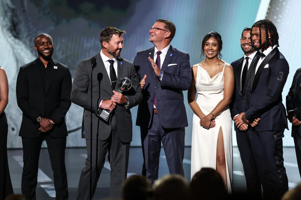 Damar Hamlin of the Buffalo Bills presents the Pat Tillman Award for Service to the trainers of the Bills at the ESPY awards in Los Angeles on Wednesday. (ABC)
