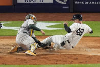 Oakland Athletics catcher Shea Langeliers, left, tags out New York Yankees' Anthony Rizzo during the seventh inning of a baseball game, Wednesday, April 24, 2024, in New York. (AP Photo/Frank Franklin II)