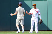 Washington Nationals center fielder Ben Revere (9) yells at a fan who ran onto the field in the ninth inning at Nationals Park in Washington, D.C. where the Washington Nationals defeated the Milwaukee Brewers, 7-4. (Photograph by Mark Goldman/Icon Sportswire via Getty Images)