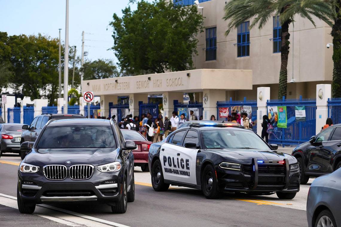 A Miami-Dade Schools police vehicles cruses outside Miami Northwestern Senior High in Miami, Florida, Friday, January 12, 2024. Miami-Dade Public Schools increased its police presence at the school the day after a student was shot on campus following a boys basketball game.