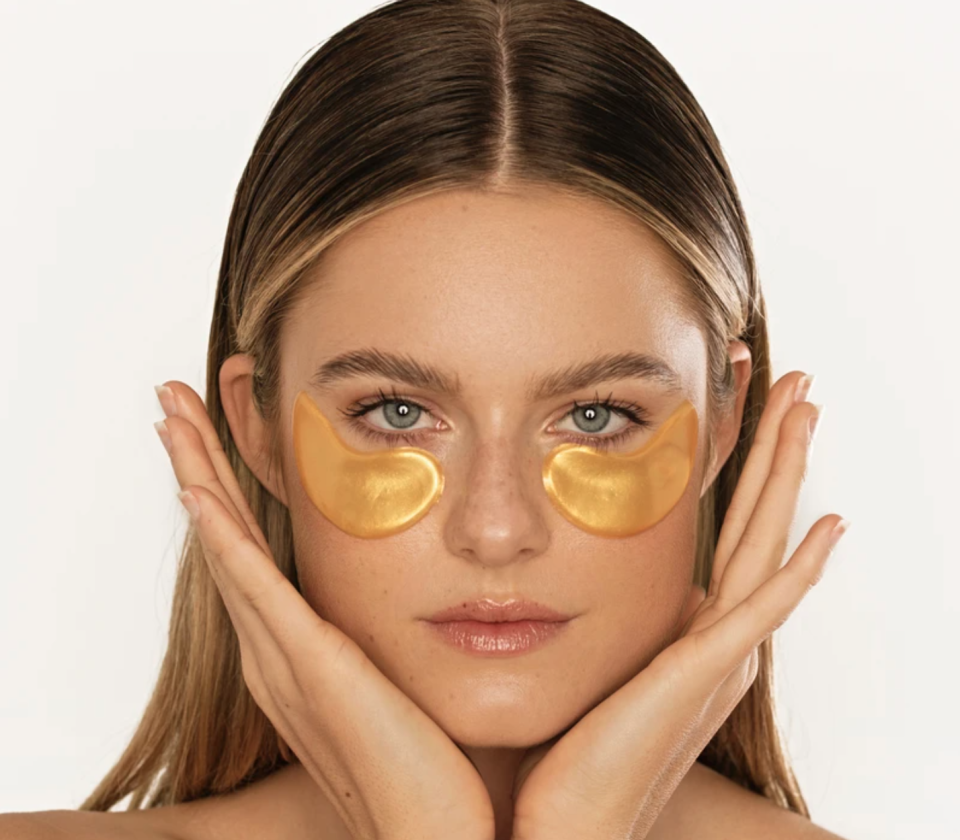 model wearing gold eye mask 