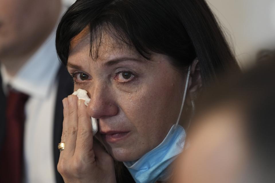 FILE - In this May 27, 2021, file photo, Natalia Pratasevich, the mother of Belarus dissident journalist Raman Pratasevich, cries during a news conference in Warsaw, Poland, where she made an emotional appeal for her son’s freedom. The journalist was arrested on Sunday, May 23, 2021, after Belarusian flight controllers told the crew of a Ryanair jetliner he was on to land in Minsk, citing a bomb threat. ​(AP Photo/Czarek Sokolowski, File)