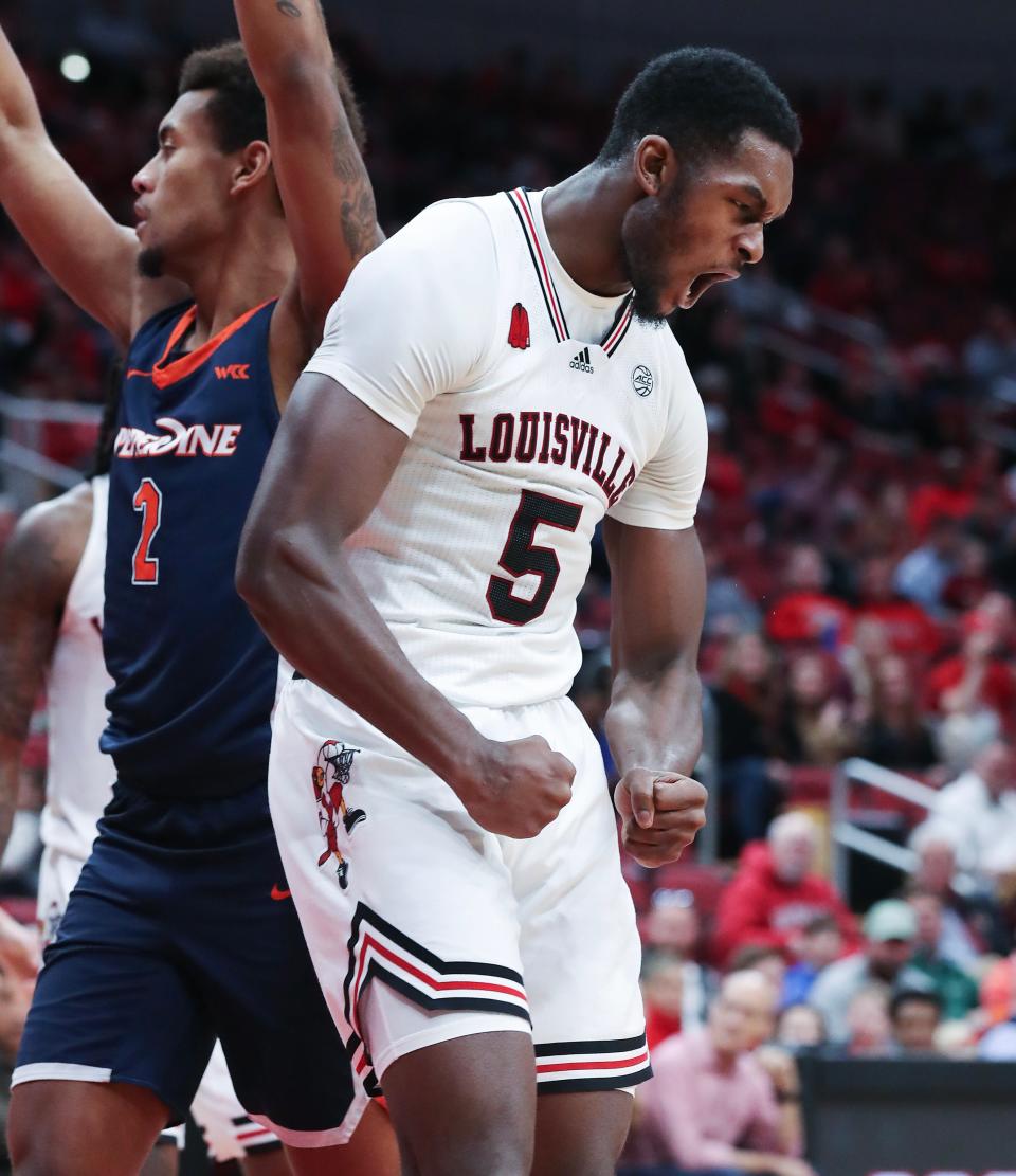 U of L's Brandon Huntley-Hatfield (5) reacts after making a shot and getting fouled against Pepperdine at the Yum! Center on Sunday.