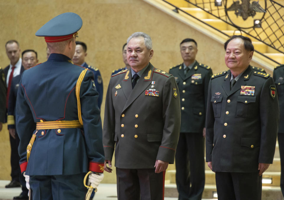 In this photo released by Russian Defense Ministry Press Service, Gen. Zhang Youxia, vice chairman of China's Central Military Commission, right, and Russian Defense Minister Sergei Shoigu, center, attend an official welcome ceremony prior to their talks in Moscow, Russia, Wednesday, Nov. 8, 2023. (Russian Defense Ministry Press Service via AP)