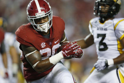 Alabama running back Tyren Jones (20) runs the ball for a touchdown during the second half of an NCAA college football game against Southern Mississippi on Saturday, Sept. 13, 2014, in Tuscaloosa, Ala. (AP Photo/Brynn Anderson)