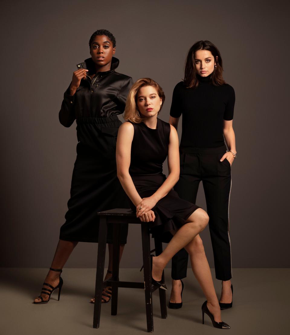 (L-R) Lashana Lynch, Léa Seydoux and Ana de Armas push the envelope in "No Time to Die."